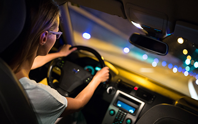 Women driving a car at night
